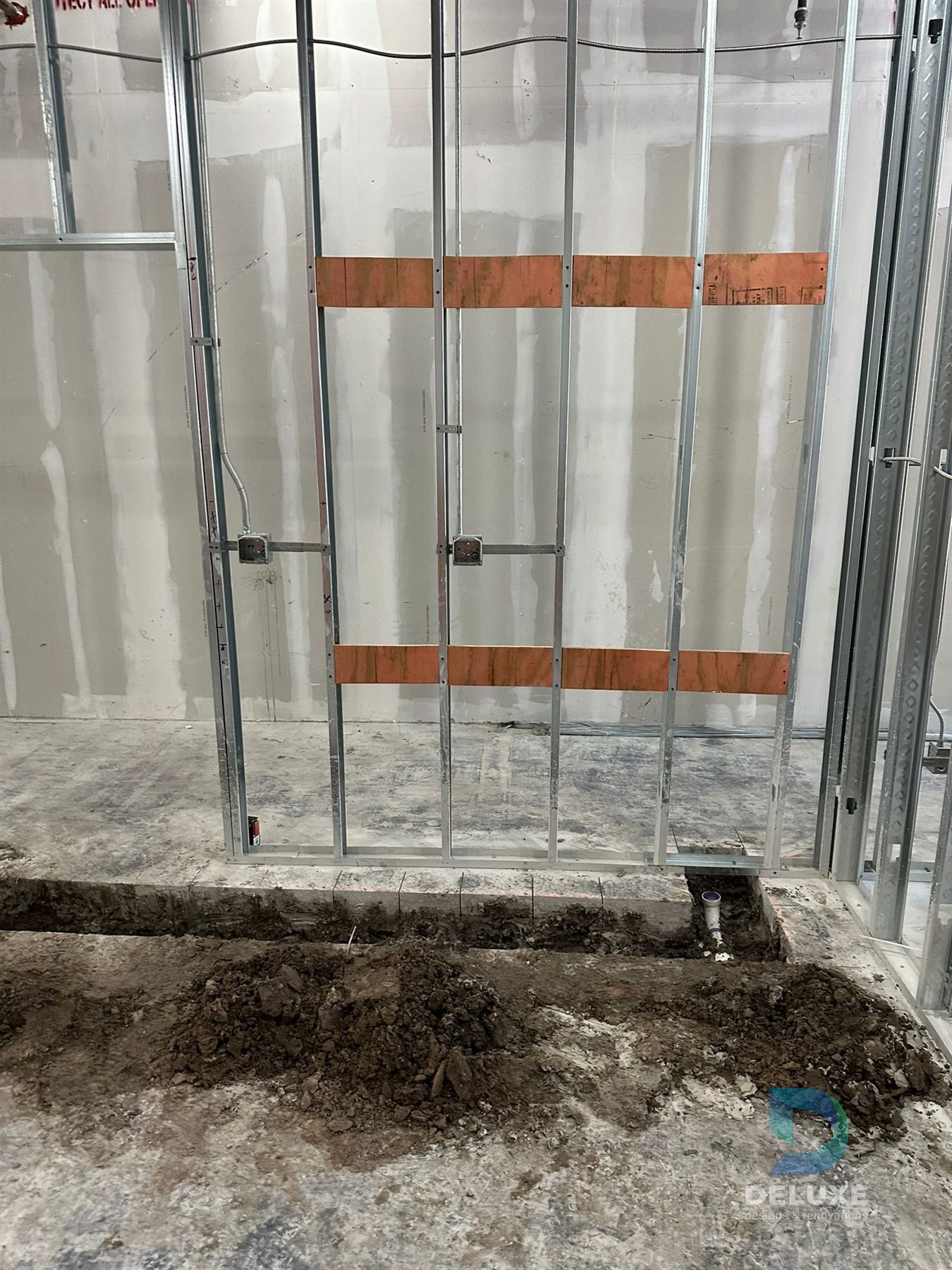 Milan Laser Valrico commercial buildout project with Deluxe Designs & Renovations watermark - Milan Laser Valrico Backing Installation
