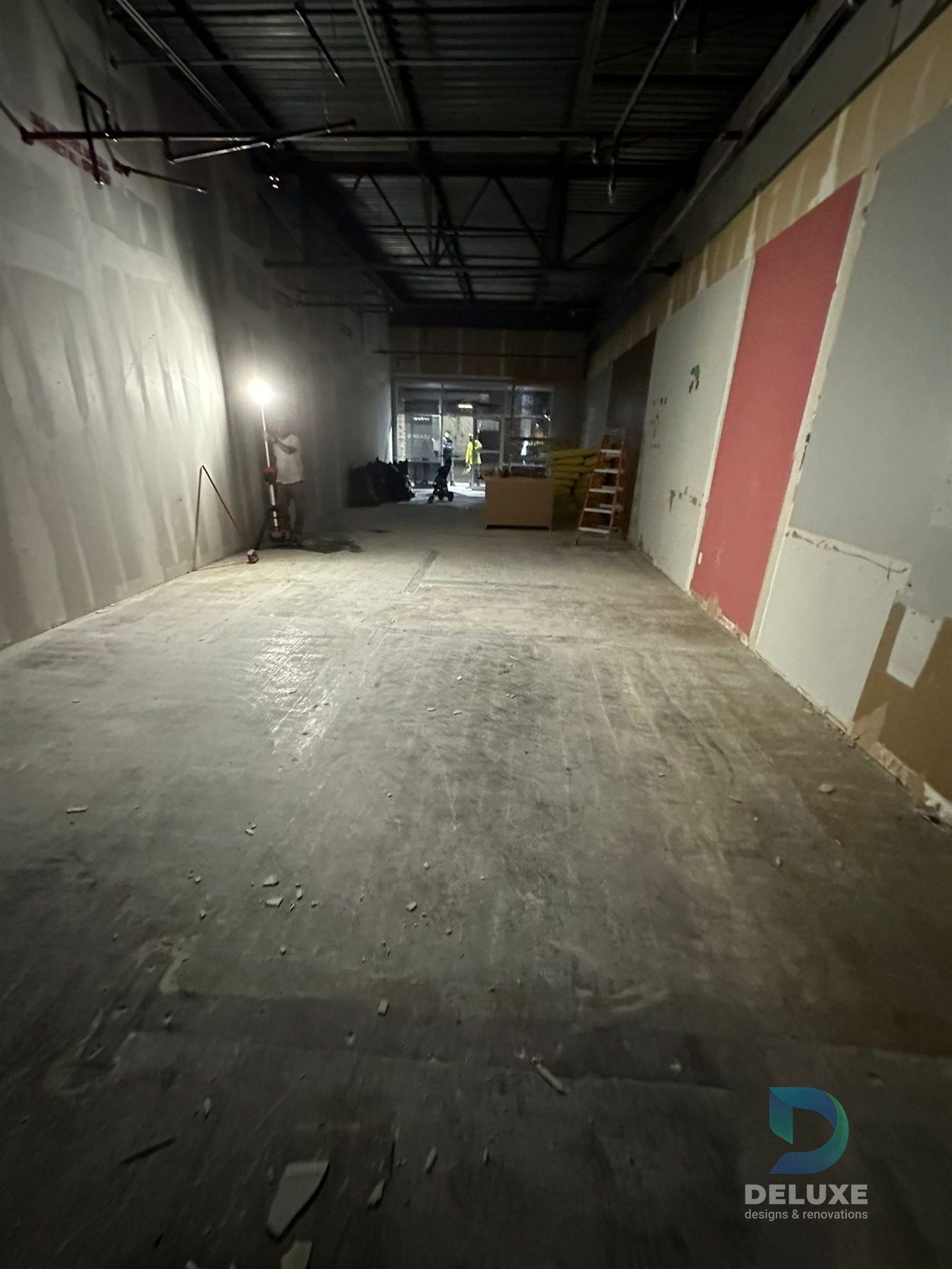 Milan Laser Valrico commercial buildout project with Deluxe Designs & Renovations watermark - Milan Laser Valrico Demo Corridor Progress
