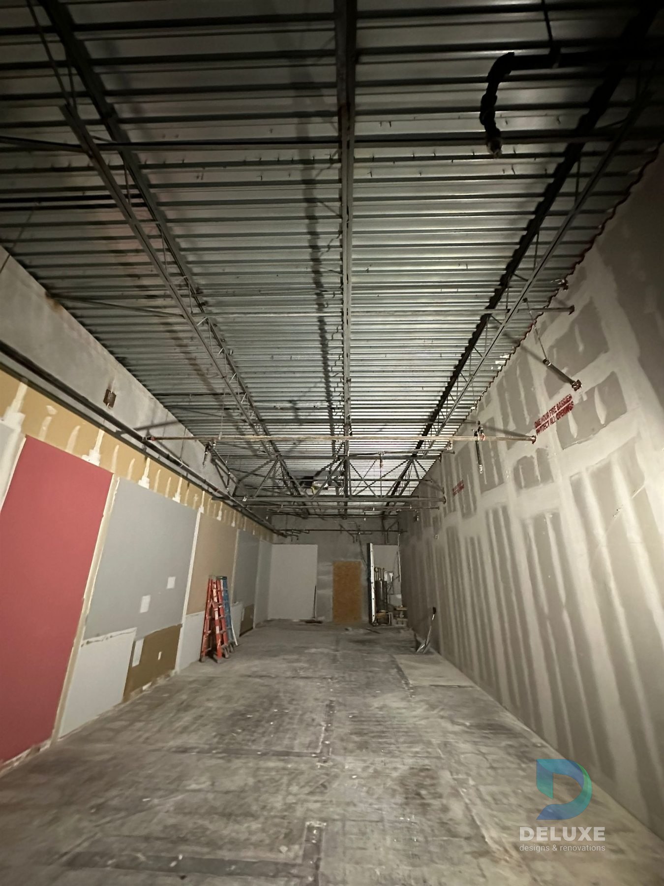 Milan Laser Valrico commercial buildout project with Deluxe Designs & Renovations watermark - Milan Laser Valrico Demo Open Ceiling