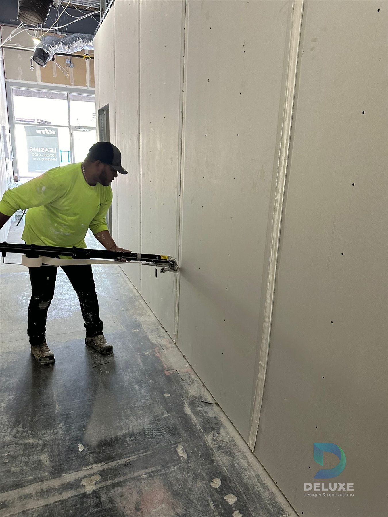 Milan Laser Valrico commercial buildout project with Deluxe Designs & Renovations watermark - Milan Laser Valrico Drywall Finishing Work