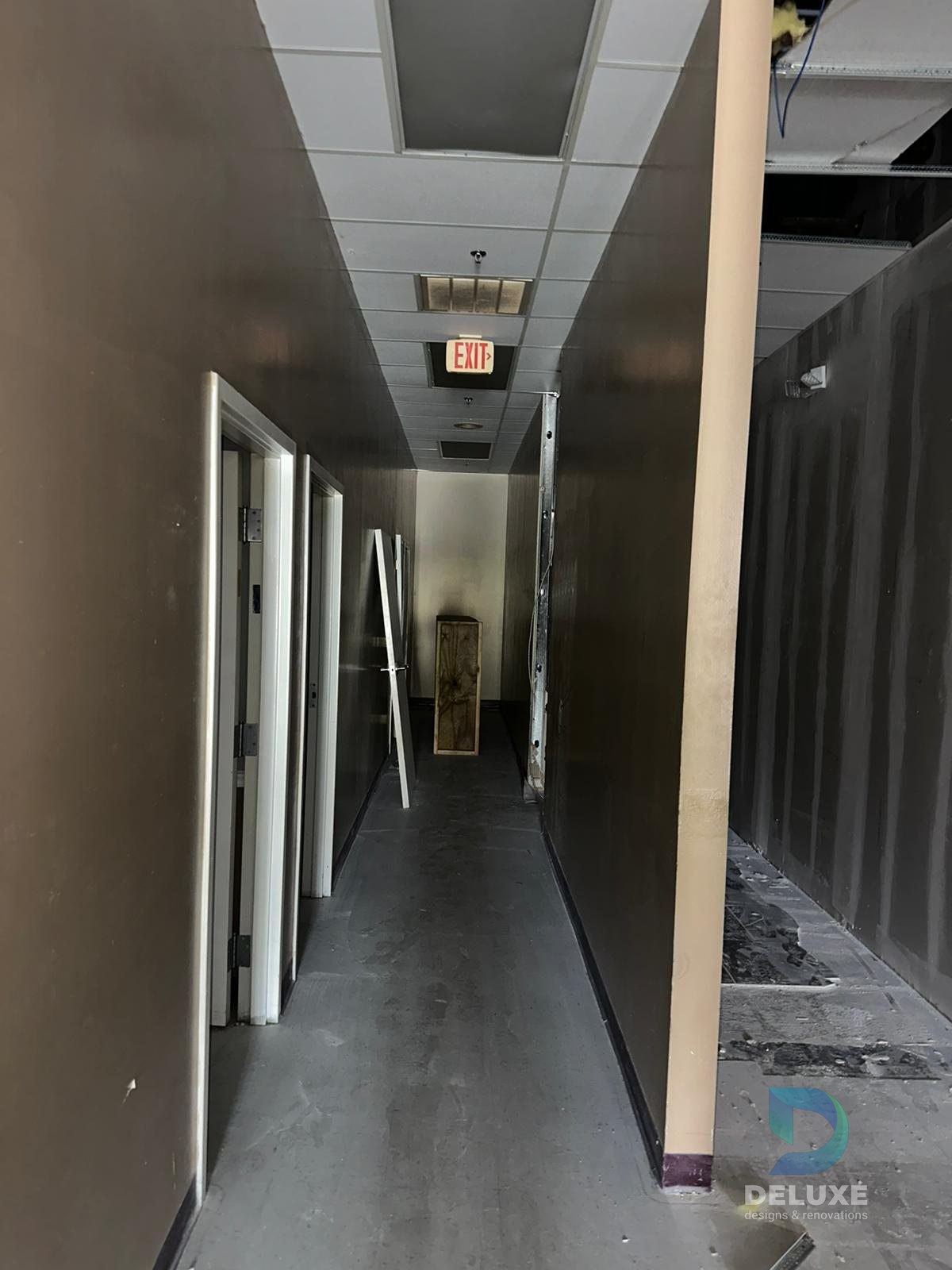 Milan Laser Valrico commercial buildout project with Deluxe Designs & Renovations watermark - Milan Laser Valrico Existing Corridor