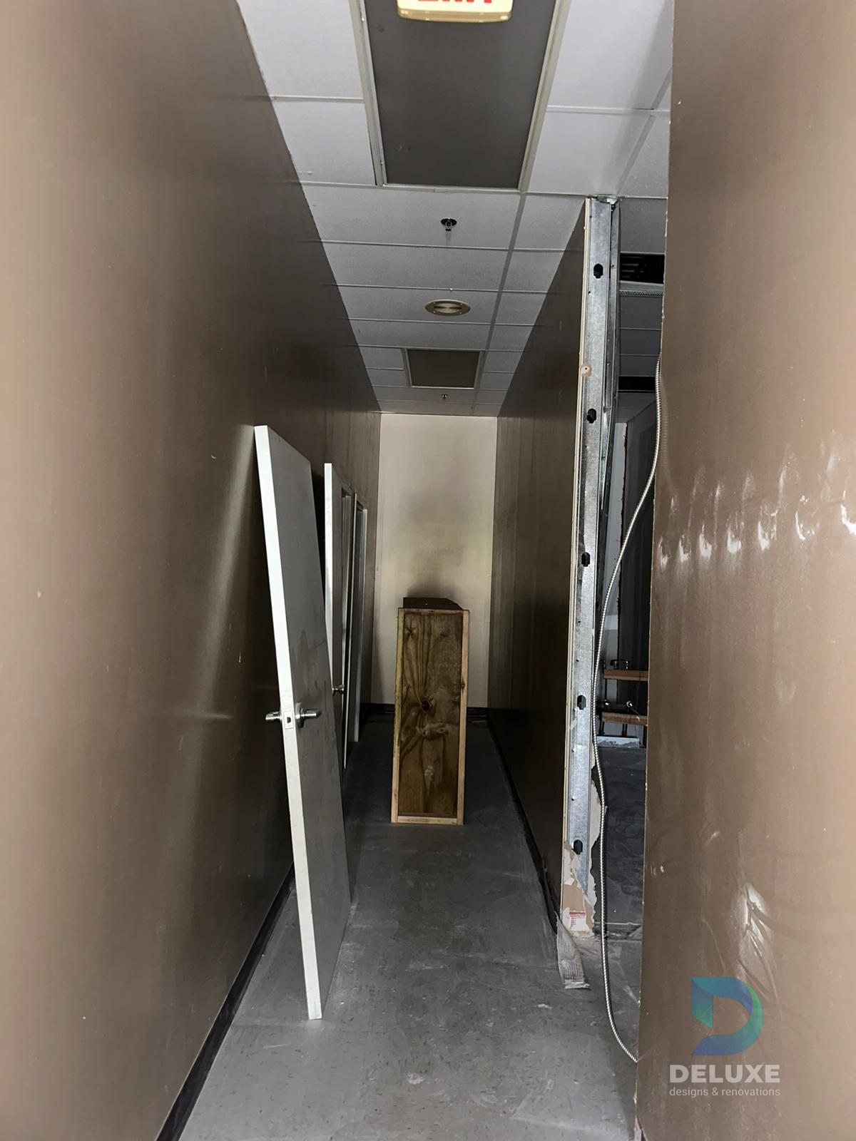 Milan Laser Valrico commercial buildout project with Deluxe Designs & Renovations watermark - Milan Laser Valrico Existing Hallway