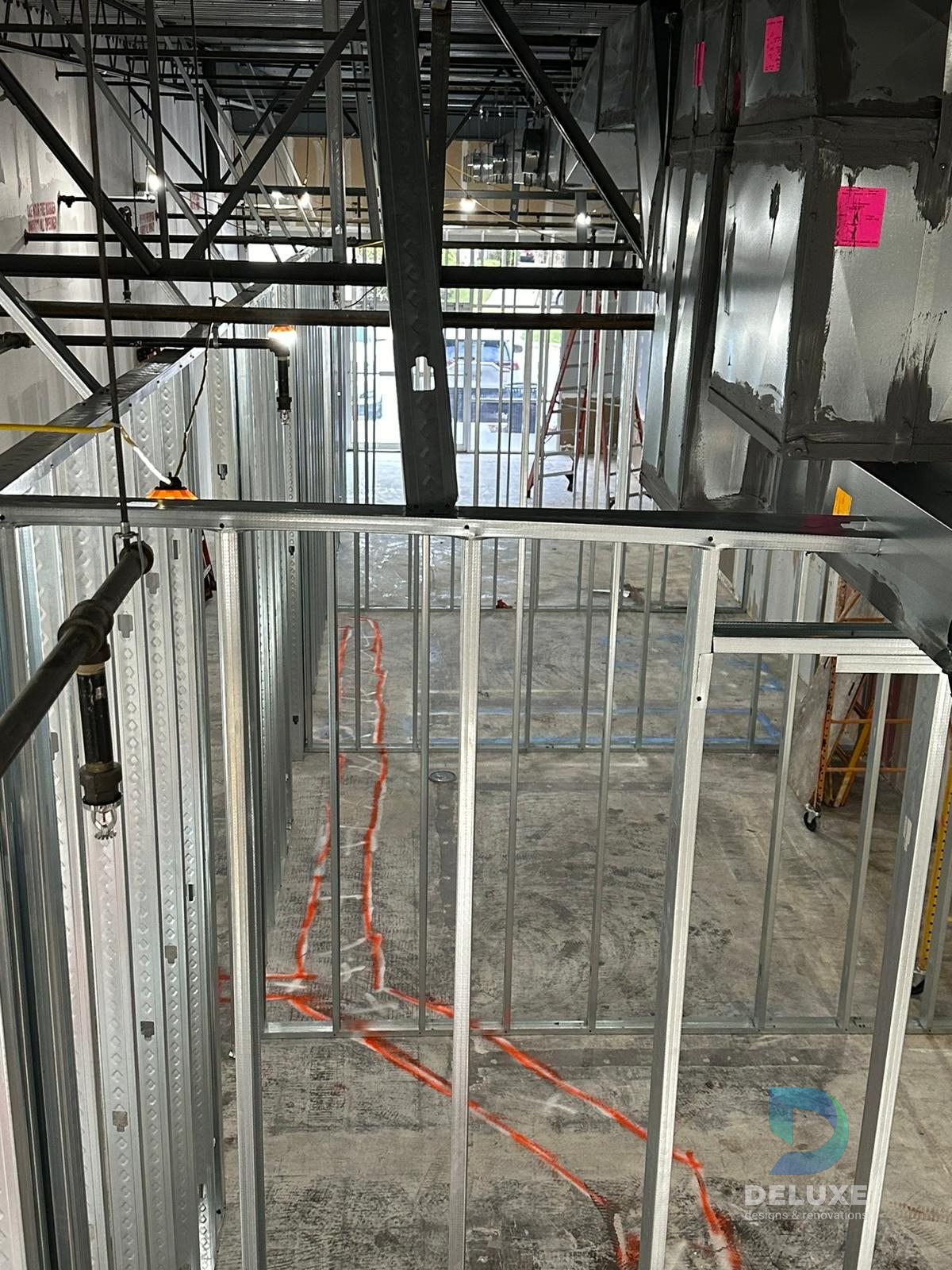 Milan Laser Valrico commercial buildout project with Deluxe Designs & Renovations watermark - Milan Laser Valrico Metal Framing Room