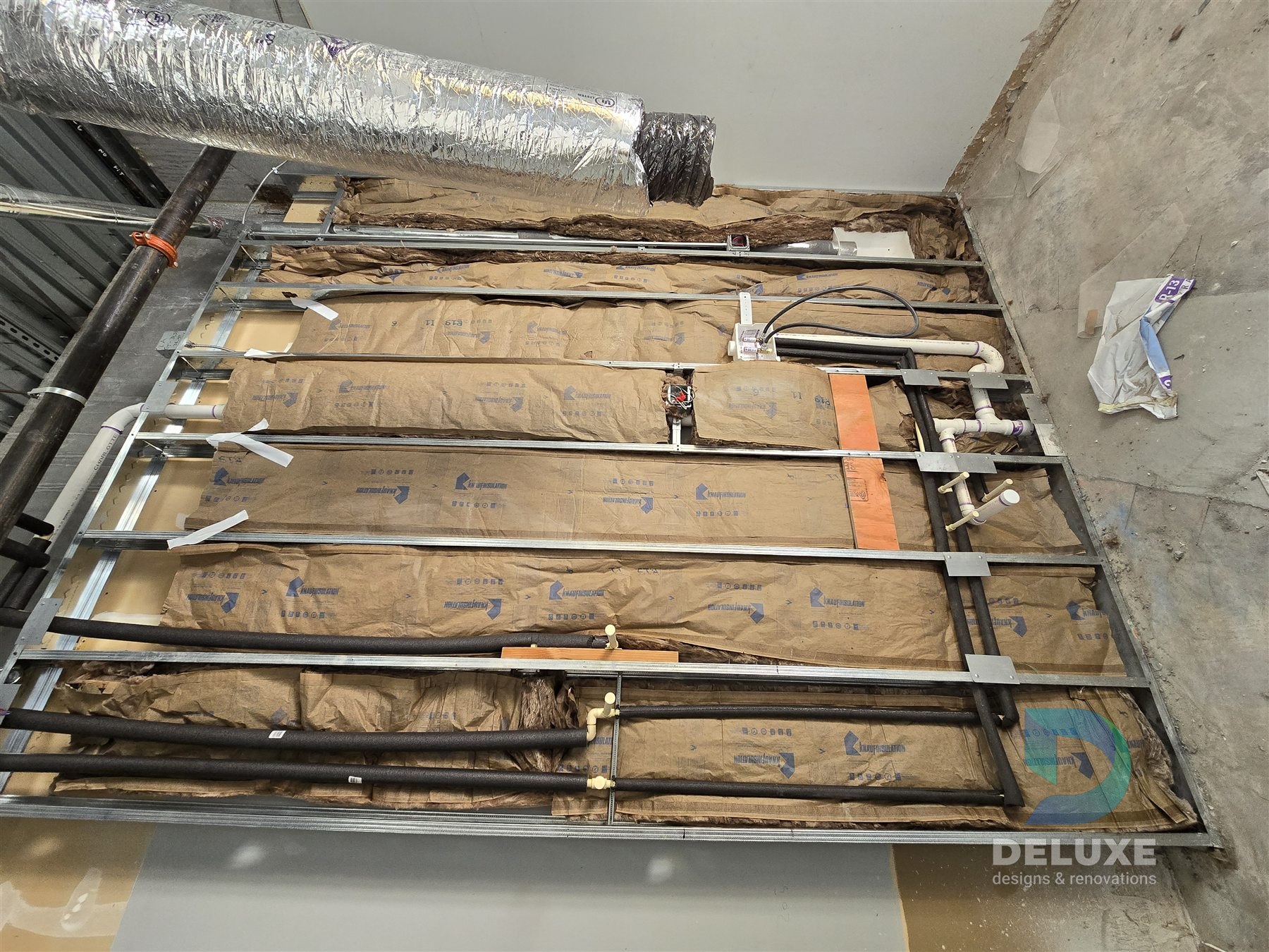 Milan Laser Valrico commercial buildout project with Deluxe Designs & Renovations watermark - Milan Laser Valrico Wall Framing Rough In