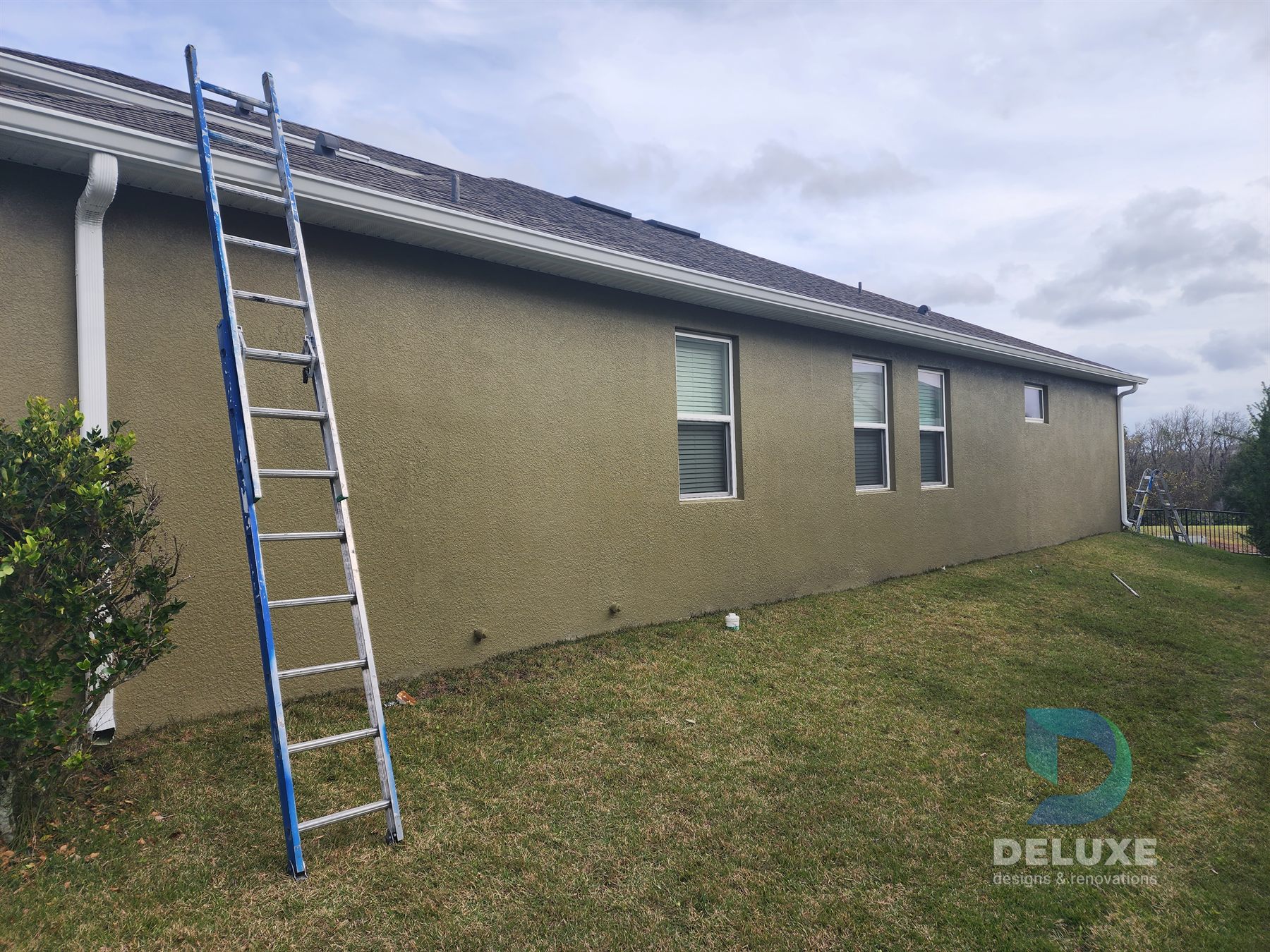 Residential exterior house painting and crack repair project photo 5