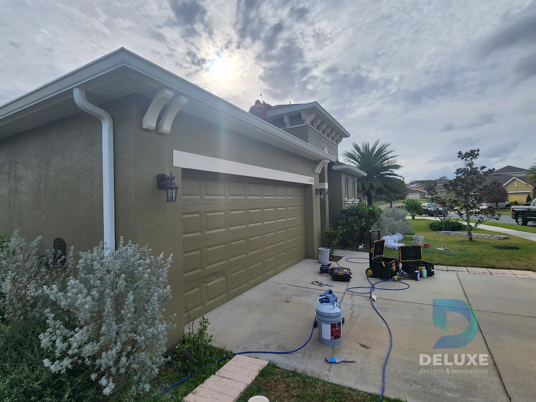 Residential exterior house painting and crack repair project photo 10