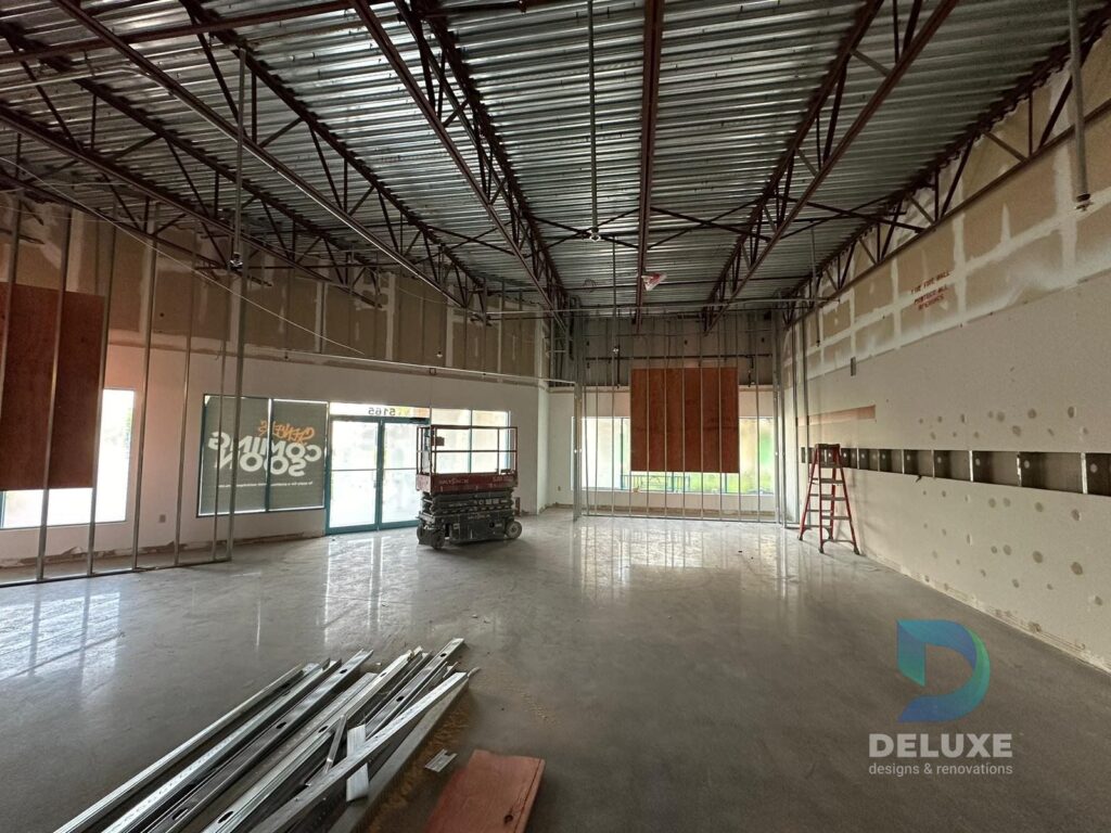 Spencer Ellenton Florida commercial buildout project with Deluxe Designs & Renovations watermark - Spencer Ellenton Wide Open Commercial Space